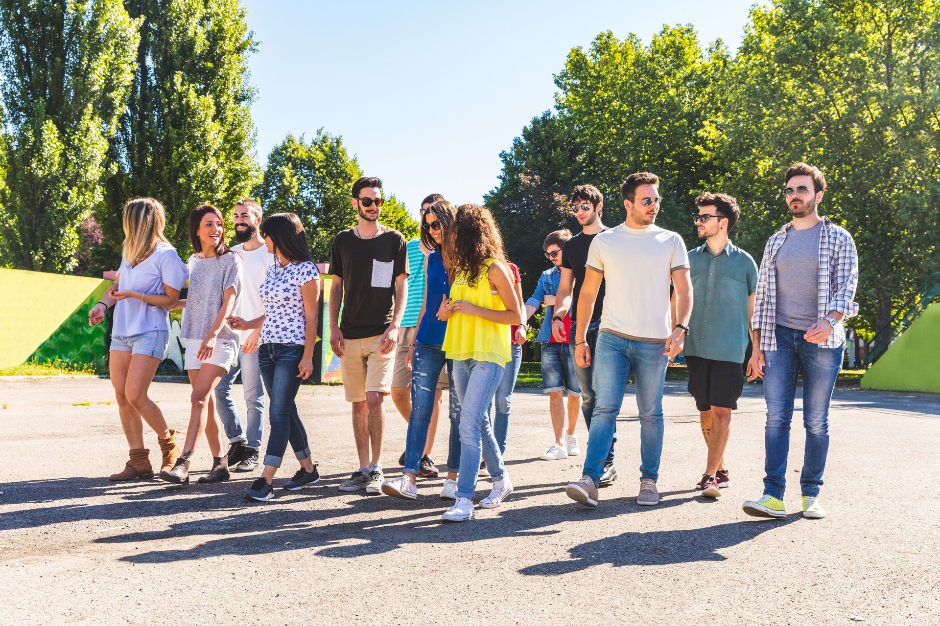 Large group of friends walking together at park